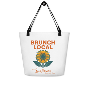 Black Sunflower Brunch Local weekender bag with colorful print.